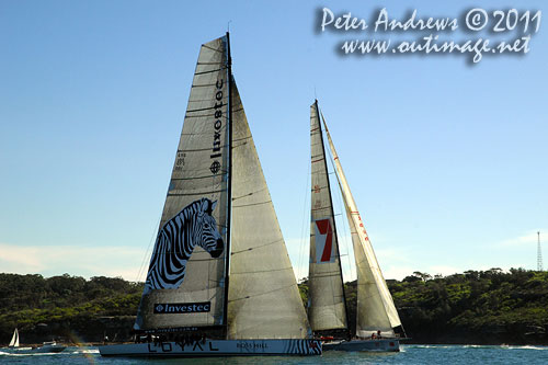 Anthony Bell's 100 ft maxi Investec Loyal and Bob Oatley's Reichel Pugh 100 Wild Oats XI tacking duel out of Sydney Harbour, after the start of the Audi Sydney Gold Coast 2011. Photo copyright Peter Andrews, Outimage Australia.