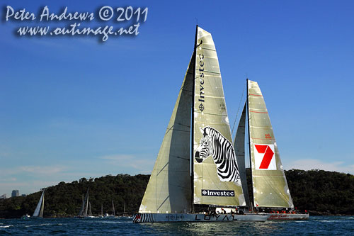 Anthony Bell's 100 ft maxi Investec Loyal and Bob Oatley's Reichel Pugh 100 Wild Oats XI tacking duel out of Sydney Harbour, after the start of the Audi Sydney Gold Coast 2011. Photo copyright Peter Andrews, Outimage Australia.