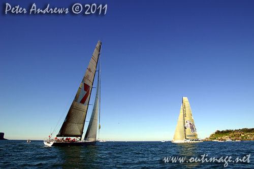 Anthony Bell's 100 ft maxi Investec Loyal and Bob Oatley's Reichel Pugh 100 Wild Oats XI tacking duel out of Sydney Harbour, after the start of the Audi Sydney Gold Coast 2011. Photo copyright Peter Andrews, Outimage Australia.