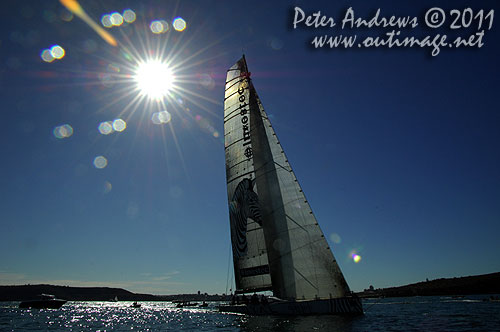 Anthony Bell's 100 ft maxi Investec Loyal on Sydney Harbour, after the start of the Audi Sydney Gold Coast 2011. Photo copyright Peter Andrews, Outimage Australia.