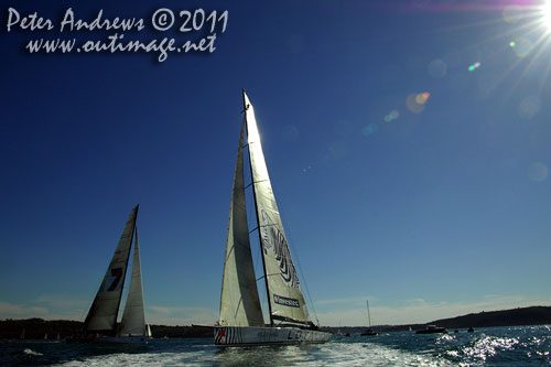 Anthony Bell's 100 ft maxi Investec Loyal and Bob Oatley's Reichel Pugh 100 Wild Oats XI tacking duel out of Sydney Harbour, after the start of the Audi Sydney Gold Coast 2011. Photo copyright Peter Andrews, Outimage Australia.