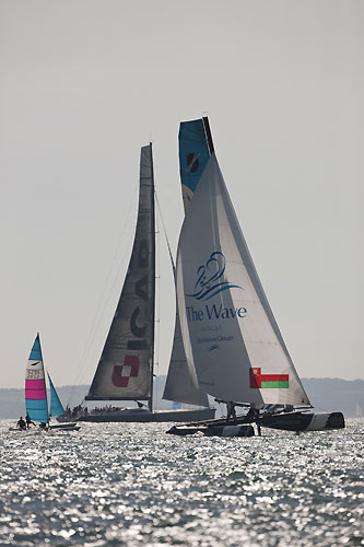 The Wave-Muscat mixing it with Mike Slade's 100 foot maxi ICAP Leopard during fleet practice racing before the start of Act 5, during the Extreme Sailing Series 2011, Cowes, United Kingdom. Photo copyright Lloyd Images.