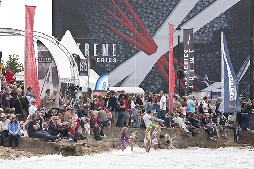 Crowds and VIP spectators are treated to a show of stadium sailing action on Day 1 of Act 5 of the Extreme Sailing Series 2011, Cowes, United Kingdom. Photo copyright Lloyd Images