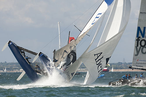 A dramatic capsize for Aberdeen Asset Management in Race 6 of Day 3 of the Extreme Sailing Series 2011, Cowes, United Kingdom. Photo copyright Lloyd Images.