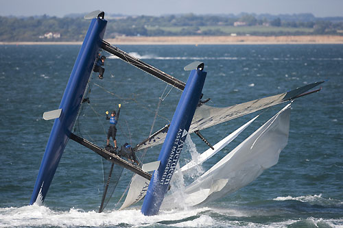 A dramatic capsize for Aberdeen Asset Management in Race 6 of Day 3 of the Extreme Sailing Series 2011, Cowes, United Kingdom. Photo copyright Lloyd Images.