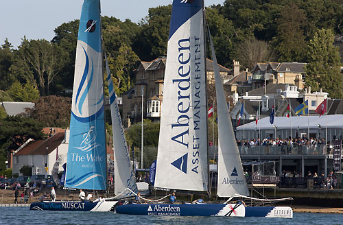 The Wave-Muscat and Aberdeen Asset Management racing in front of the Race Village on Day 4 at the Extreme Sailing Series 2011, Cowes, United Kingdom. Photo copyright Lloyd Images.