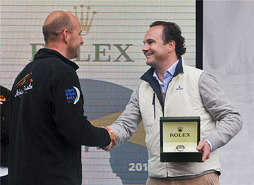 Lionel Schurch, Rolex SA, presenting Ian Walker the Rolex Yacht Master for line honours monohull winner with Volvo 70 Abu Dhabi Ocean Racing (UAE), during the Rolex Fastnet Race 2011. Photo copyright Rolex and Carlo Borlenghi.