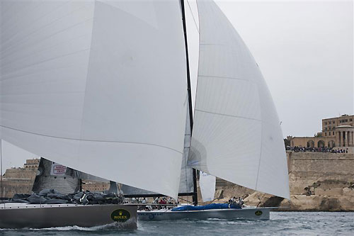 Niklas Zennstr�m�s JV72, R�n (GBR) and Andres Soriano�s Mills 68 Alegre (GBR) sail out of Grand Harbour, during the Rolex Middle Sea Race 2011. Photo copyright Kurt Arrigo, Rolex.