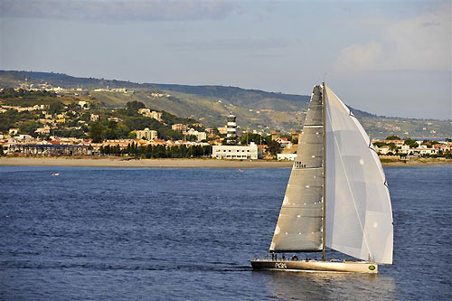 Niklas Zennström’s JV72, Rán (GBR) passing through the Strait of Messina with Capo Peloro lighthouse in the background, during the Rolex Middle Sea Race 2011. Photo copyright Kurt Arrigo, Rolex.