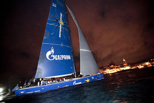 Igor Simcic�s Esimit Europa 2 (SLO), crossing the finish line at Marsamxett Harbour, Valetta, Malta, to claim line honours in the 2011 Rolex Middle Sea Race. Photo copyright Rene Rossignaud, Rolex.