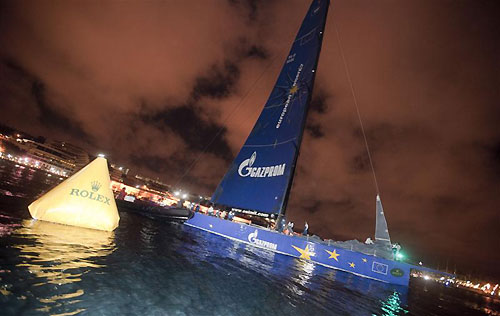 Igor Simcic�s Esimit Europa 2 (SLO), crossing the finish line at Marsamxett Harbour, Valetta, Malta, to claim line honours in the 2011 Rolex Middle Sea Race. Photo copyright Rene Rossignaud, Rolex.