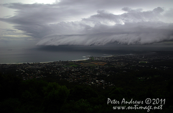 Seen from Bulli Lookout near Wollongong, a storm front cloud band rolls up the New South Wales over the Tasman Sea, during the first evening at sea for the 2011 Rolex Sydney Hobart Fleet. Photo Copyright Peter Andrews, Outimage Australia.