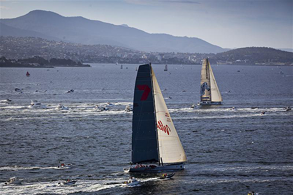 The narrow gap between Anthony Bell�s Investec Loyal and Wild Oats XI on the Derwent River approaching the Hobart finish line. Photo copyright Daniel Forster, Rolex.