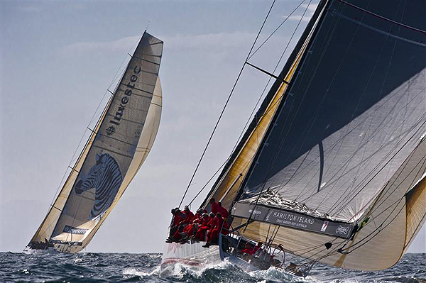Anthony Bell�s Investec Loyal and Bob Oatley's Wild Oats XI, skippered by Mark Richards, approaching the Hobart finish line. Photo copyright Kurt Arrigo, Rolex.