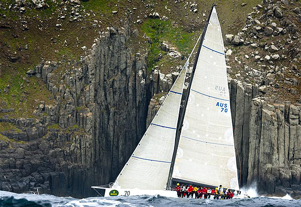 Syd Fischer's TP52 Ragamuffin passing at Cape Raoul, during the 2011 Rolex Sydney Hobart Yacht Race. Photo copyright Rolex Kurt Arrigo.
