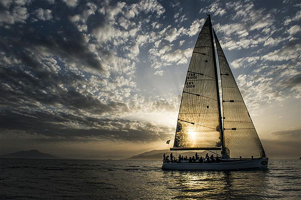 Gérard Logel's Arobas (FRA), is welcomed by the sunrise for her arrival to Capri to complete leg one of the Rolex Volcano Race 2012. Photo copyright Kurt Arrigo for Rolex.