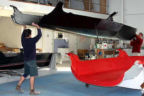 The bare hull carried by two people. Photo copyright Van Munster Boats for the Australian 18 Footers League.