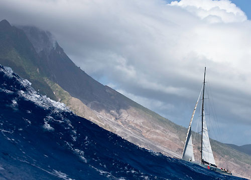 Mike Slade's 100ft Maxi ICAP Leopard passing Montessart's active volcano, RORC Caribbean 600. Photo copyright Carlo Borlenghi.