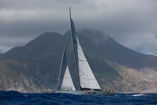 Mike Slade's 100ft Maxi ICAP Leopard passing Montessart's active volcano, RORC Caribbean 600. Photo copyright Carlo Borlenghi.