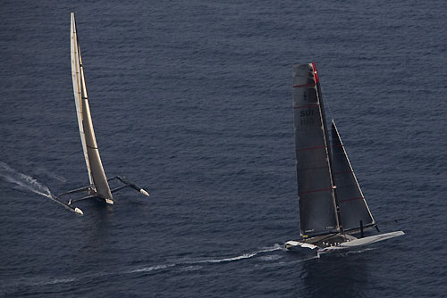 Valencia, Spain, February 14, 2010. Day 7, Alinghi crosses USA17 anear the windward mark during Race 2 of the 33rd America's Cup. Photo copyright Carlo Borlenghi, Alinghi.