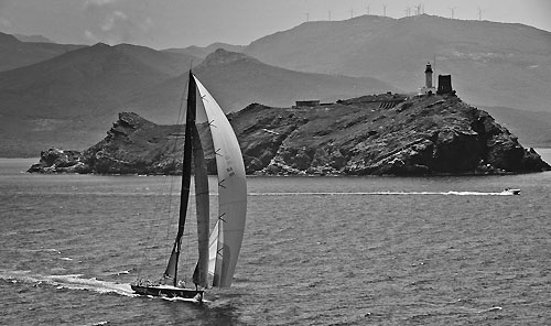 Igor Simcic's Esimit Europa 2 passes Giraglia Rock, during the Giraglia Rolex Cup 2011, Saint-Tropez, France, June 18-25. Photo copyright Rolex and Carlo Borlenghi.