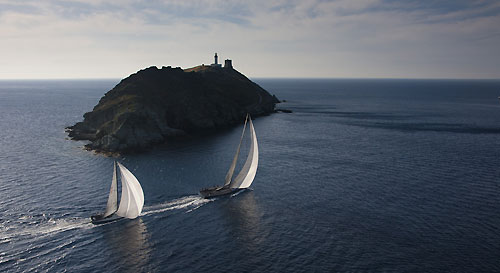 Brian Benjamin's Carbon Ocean 82, Aegir and Noel Franck's Near Miss rounding Giraglia Rock, during the Giraglia Rolex Cup 2011, Saint-Tropez, France, June 18-25. Photo copyright Rolex and Carlo Borlenghi.