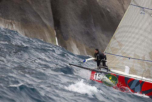 Bowman at work on Horacio Pavez's Soto 40 Acuario II / Mitsubishi (CHI), during the Rolex Ilhabela Sailing Week 2011. Acuario II / Mitsubishi (CHI) se prepara para contornar a ilha Alcatrazes. Photo copyright Rolex and Carlo Borlenghi.