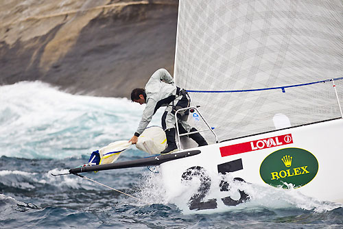 The bowman at work on Marcelo Massa's Soto 40 Loyal (BRA) , during the Rolex Ilhabela Sailing Week 2011. Loyal (BRA) se prepara para subir o balão. Photo copyright Rolex and Carlo Borlenghi.