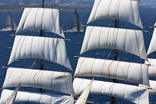 Through the rig of a beautiful tall ship, Paolo Scerni's Kora 5 and Marco Rodolfi's Berenice Bis, during the Maxi Yacht Rolex Cup 2011, Porto Cervo, Italy. Photo copyright Carlo Borlenghi for Rolex.