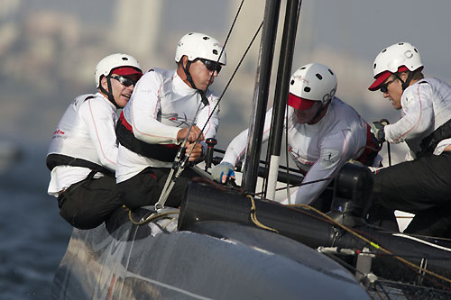 Terry Hutchinson's crew at work on Artemis Racing at the America's Cup World Series, Cascais, Portugal, August 6-14, 2011. Photo copyright Morris Adant.