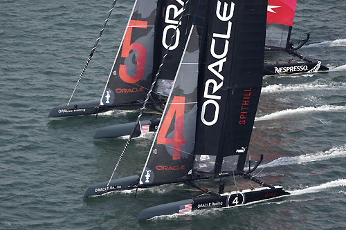 James Spithill's and Russell Coutts' ORACLE Racing AC45 wing-sailed catamarans at the America's Cup World Series, Cascais, Portugal, August 6-14, 2011. Photo copyright Morris Adant.