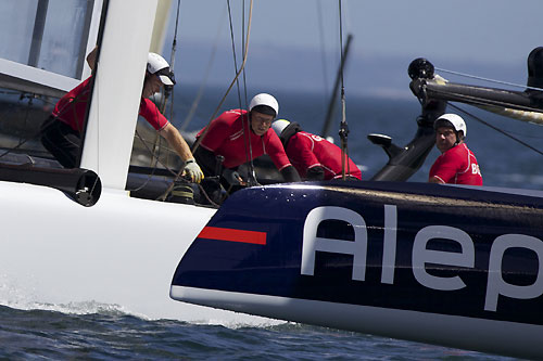 Charlie Ogletree's China Team look over at Bertrand Pacs Aleph at the America's Cup World Series, Cascais, Portugal, August 6-14, 2011. Photo copyright Morris Adant.